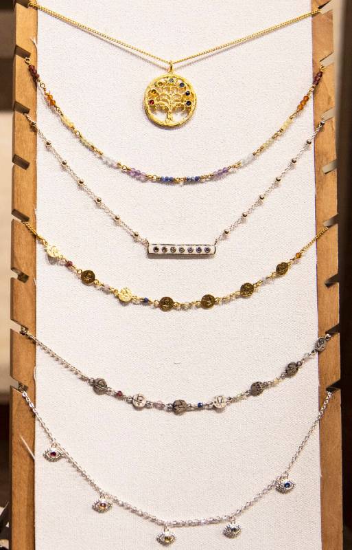 Necklaces are displayed at Karma and Luck retail store on Thursday Feb. 10, 2022, in Las Vegas. ...