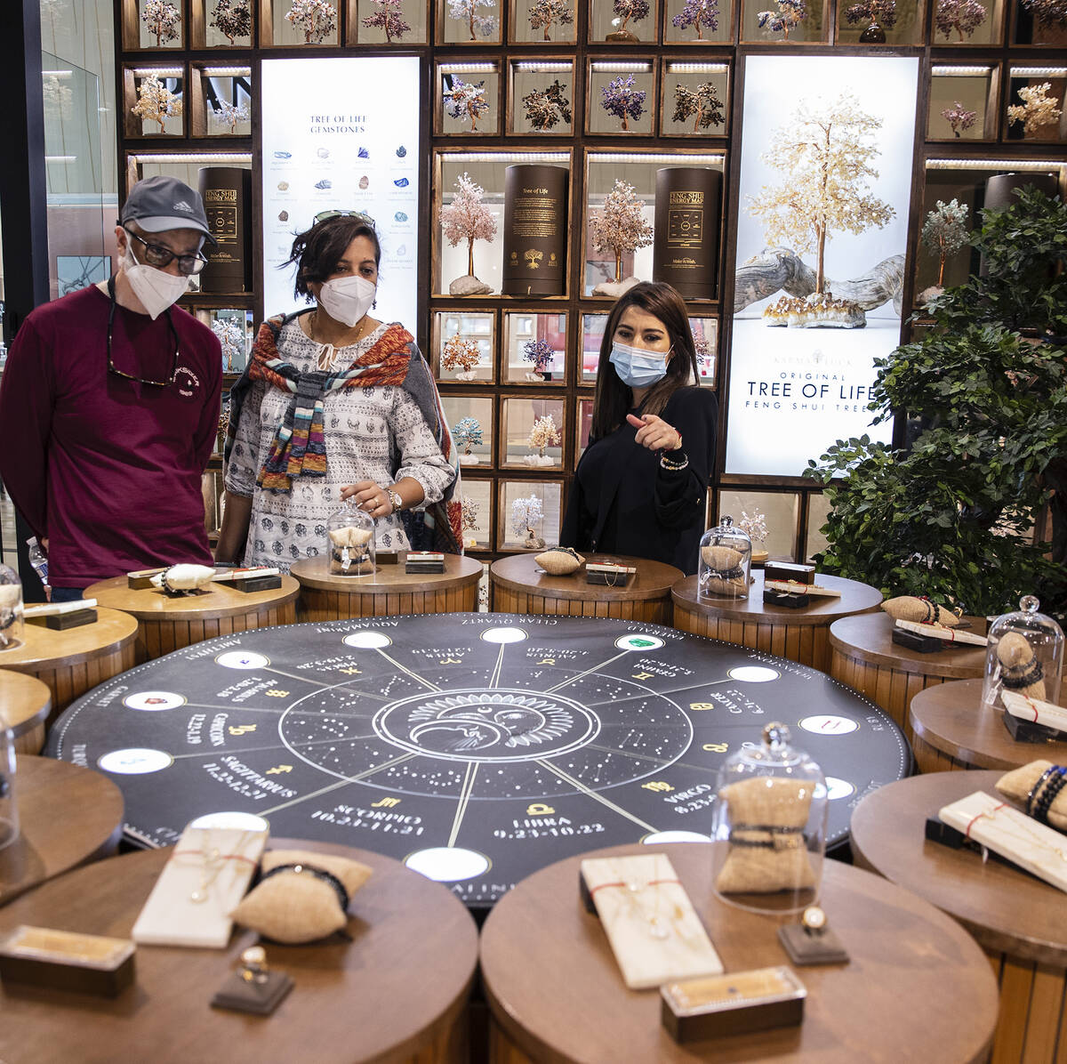 Pauline Rodriguez, right, helps customers at Karma and Luck on Thursday Feb. 10, 2022, in Las V ...