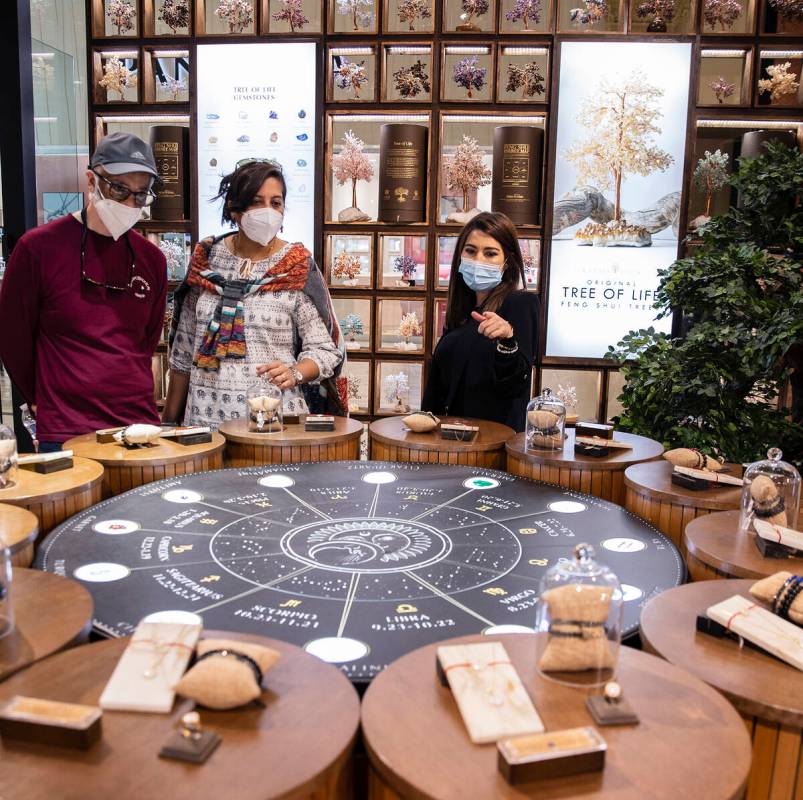 Pauline Rodriguez, right, helps customers at Karma and Luck on Thursday Feb. 10, 2022, in Las V ...