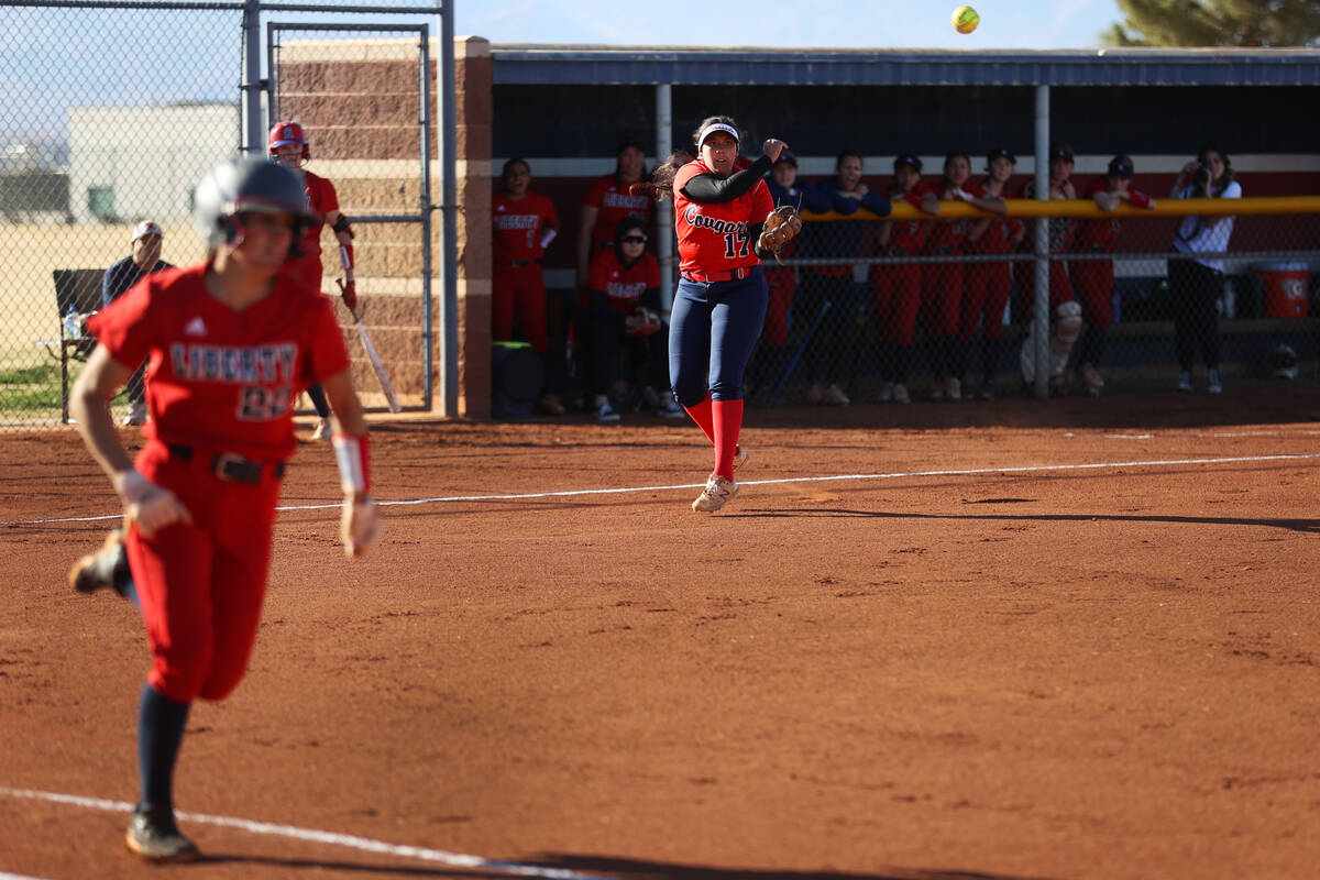 Coronado’s Jasmyn Lara (17) throws the ball to first base as Liberty’s Isabella A ...