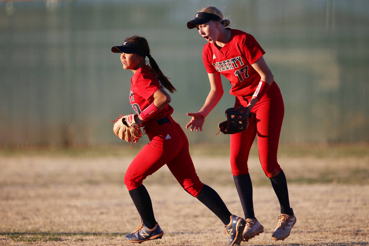 Liberty’s Jesse Farrell (17) reacts after Jaydah Chun (50) made a catch in the outfield ...