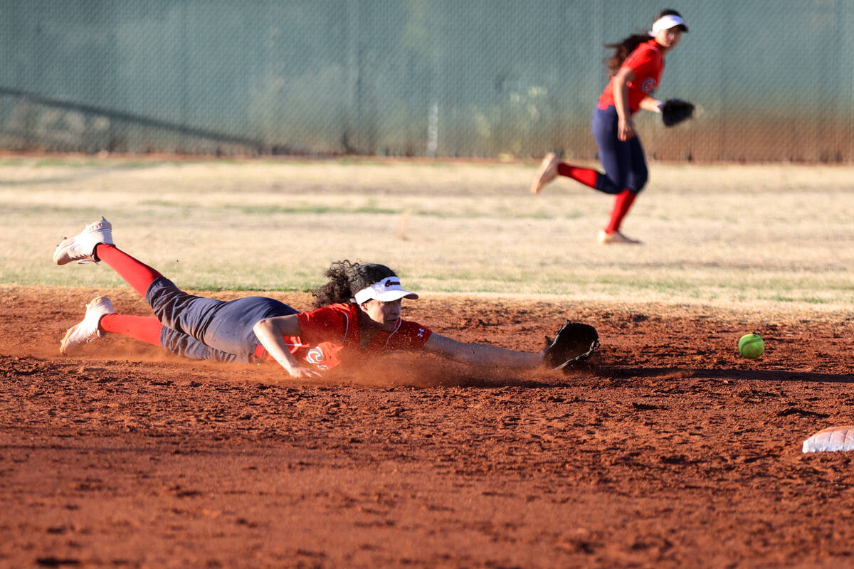 Coronado’s DeMia Stamps (7) misses the ball to allow a Liberty hit during a softball gam ...