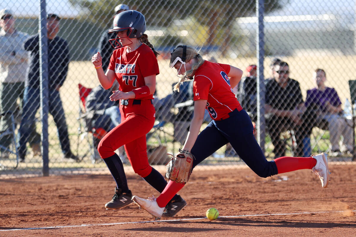 Coronado’s Kendall Selitzsky (9) drops the ball as Liberty’s Justice Lavin (77) r ...