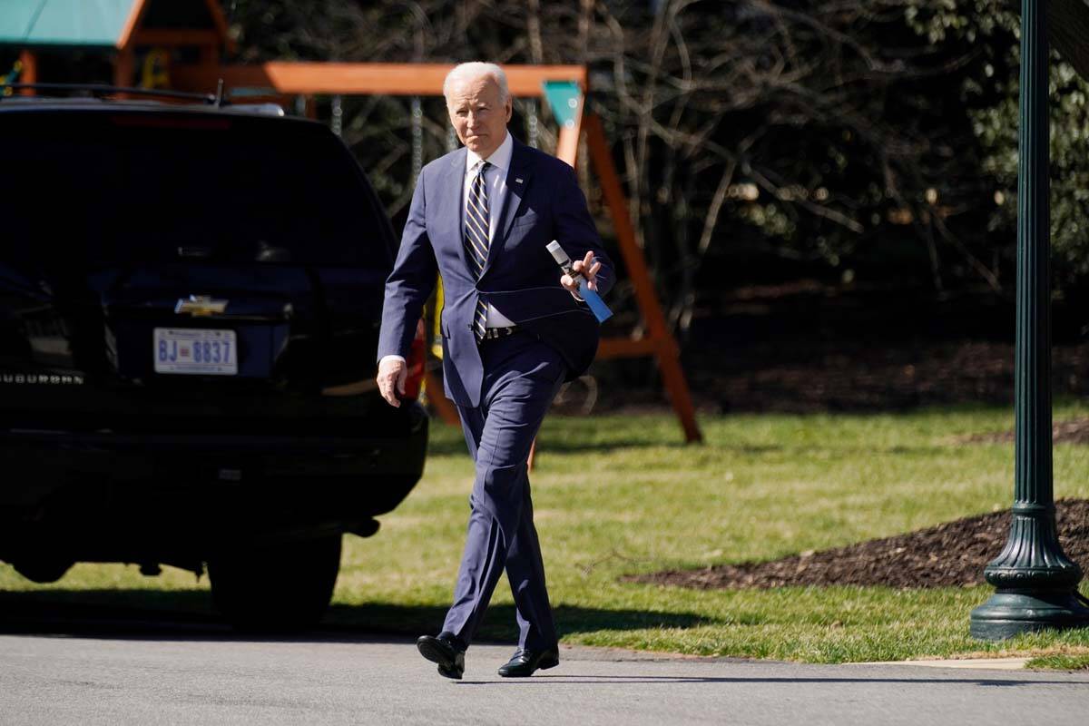 President Joe Biden walks to board Marine One on the South Lawn of the White House, Tuesday, Ma ...
