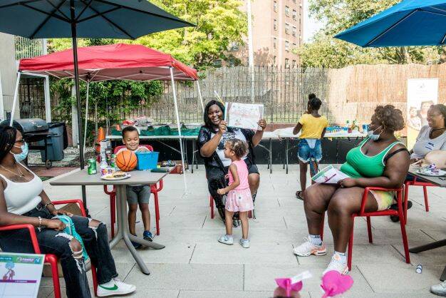 Jeremiah Program members read outside in Brooklyn, New York, in an undated photo. (Courtesy of ...