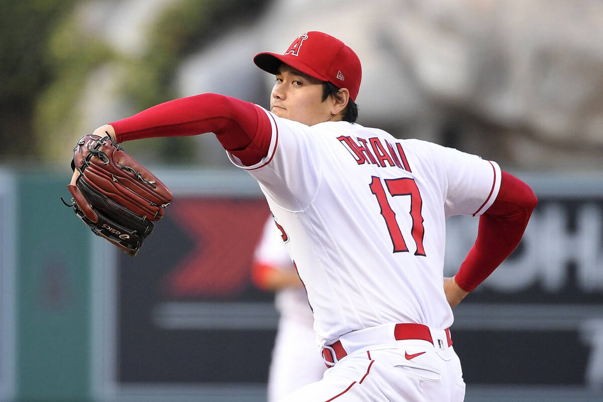 Los Angeles Angels starting pitcher Shohei Ohtani throws to the plate during the first inning o ...