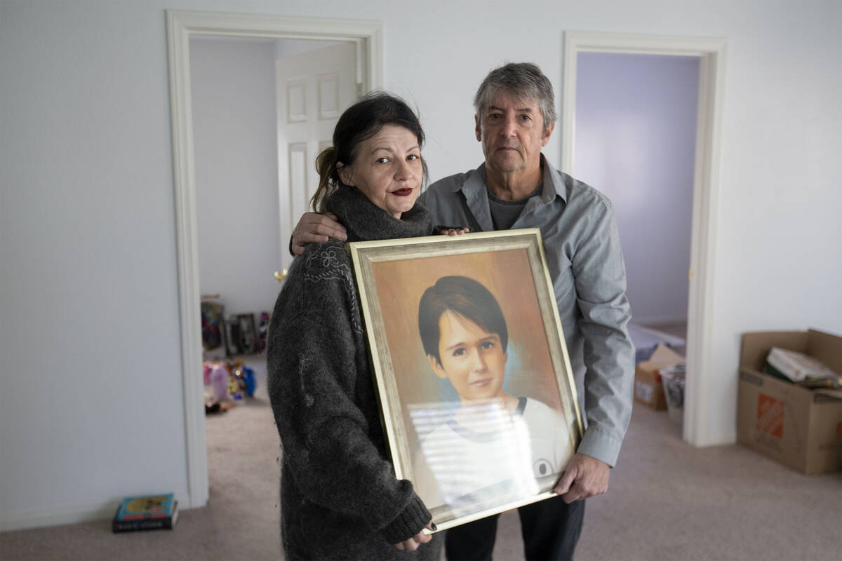 Mihaela and Tom Steyer hold a painting of their son Louis Steyer on Jan. 14, 2022, at their Las ...
