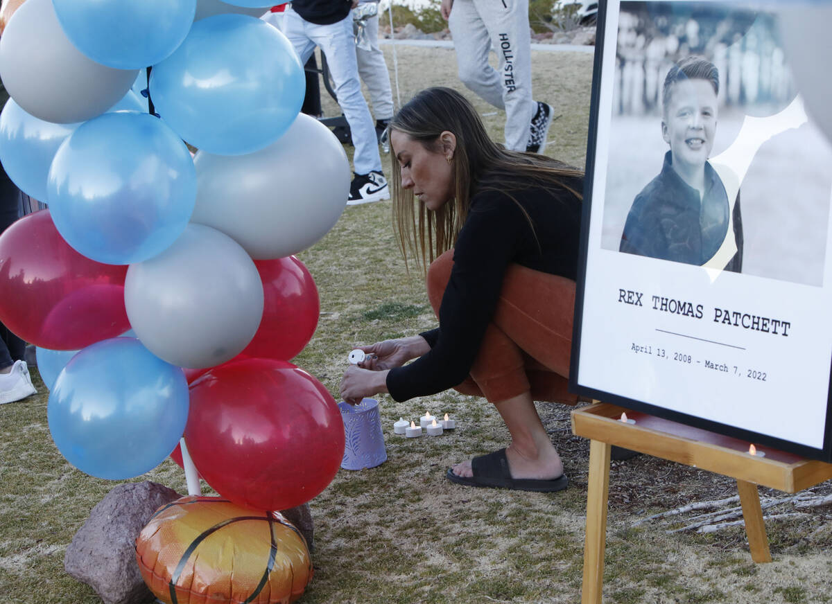 Carly LeDuc of Henderson prepares candles, Friday, March 11, 2022, during a remembrance ceremo ...