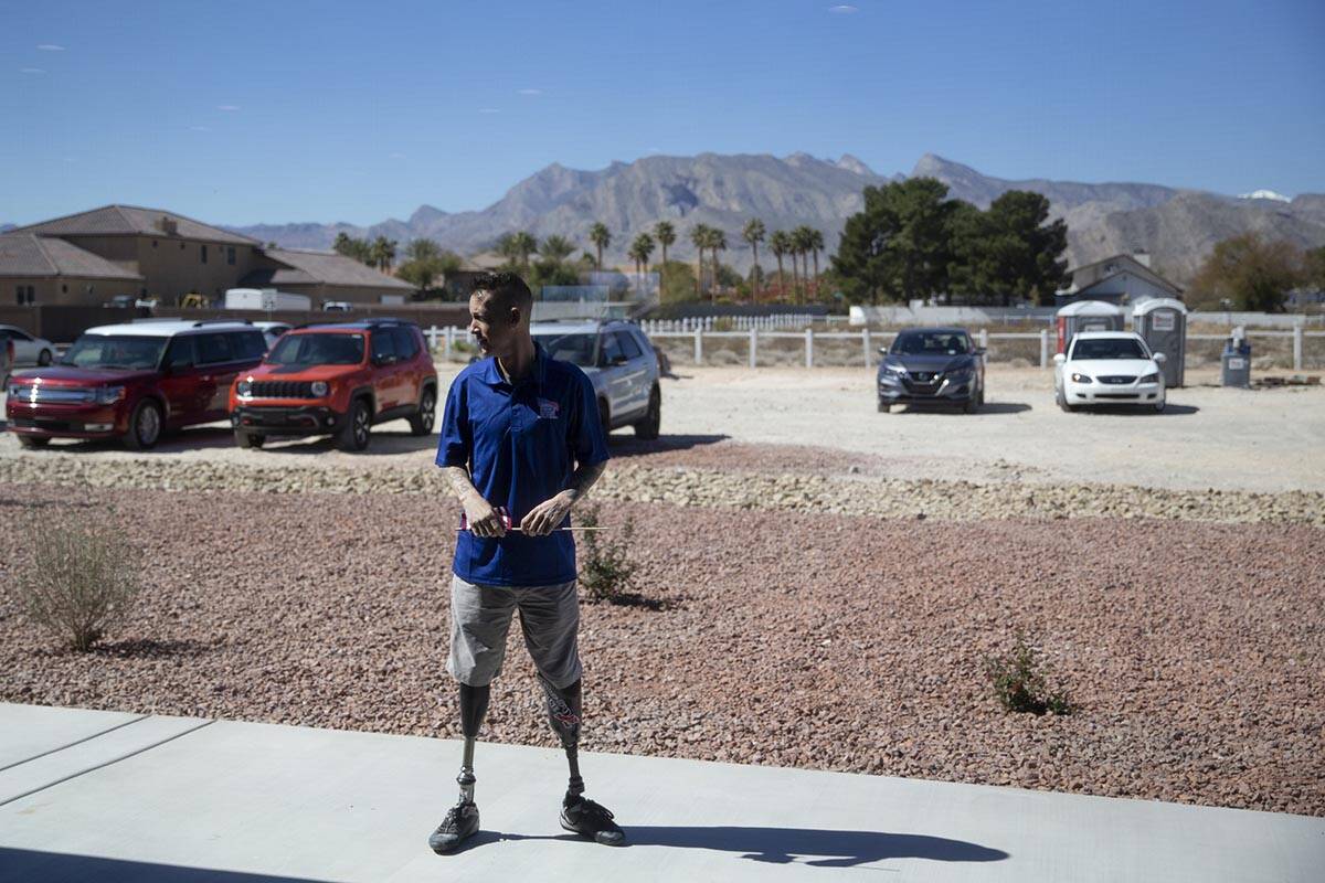Army Sergeant Adam Poppenhouse, who was injured in Iraq in 2006, takes a moment alone after see ...