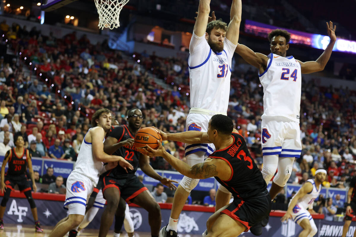 San Diego State Aztecs guard Matt Bradley (3) looks for an open pass under pressure from Boise ...