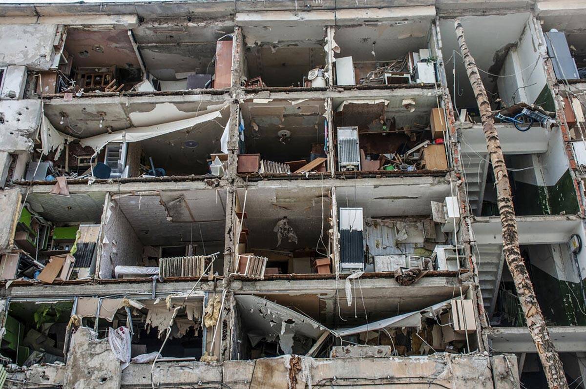 A view of destroyed apartments damaged by shelling, in Kharkiv, Ukraine, Sunday, March 13, 2022 ...