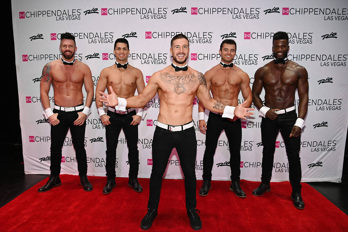 Actor Vinny Guadagnino poses for a photo with the cast of Chippendales during the show's 20 ann ...
