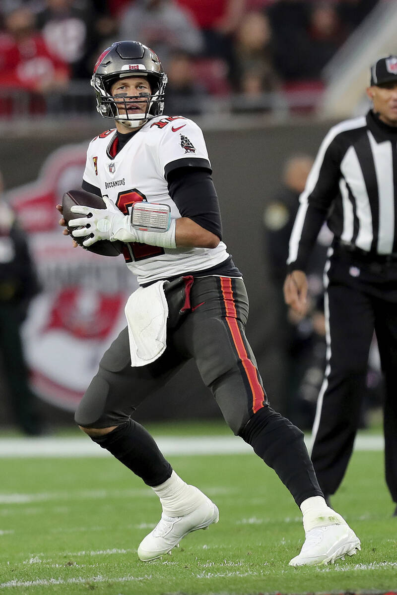 Tampa Bay Buccaneers quarterback Tom Brady (12) drops back to pass during a NFL divisional play ...