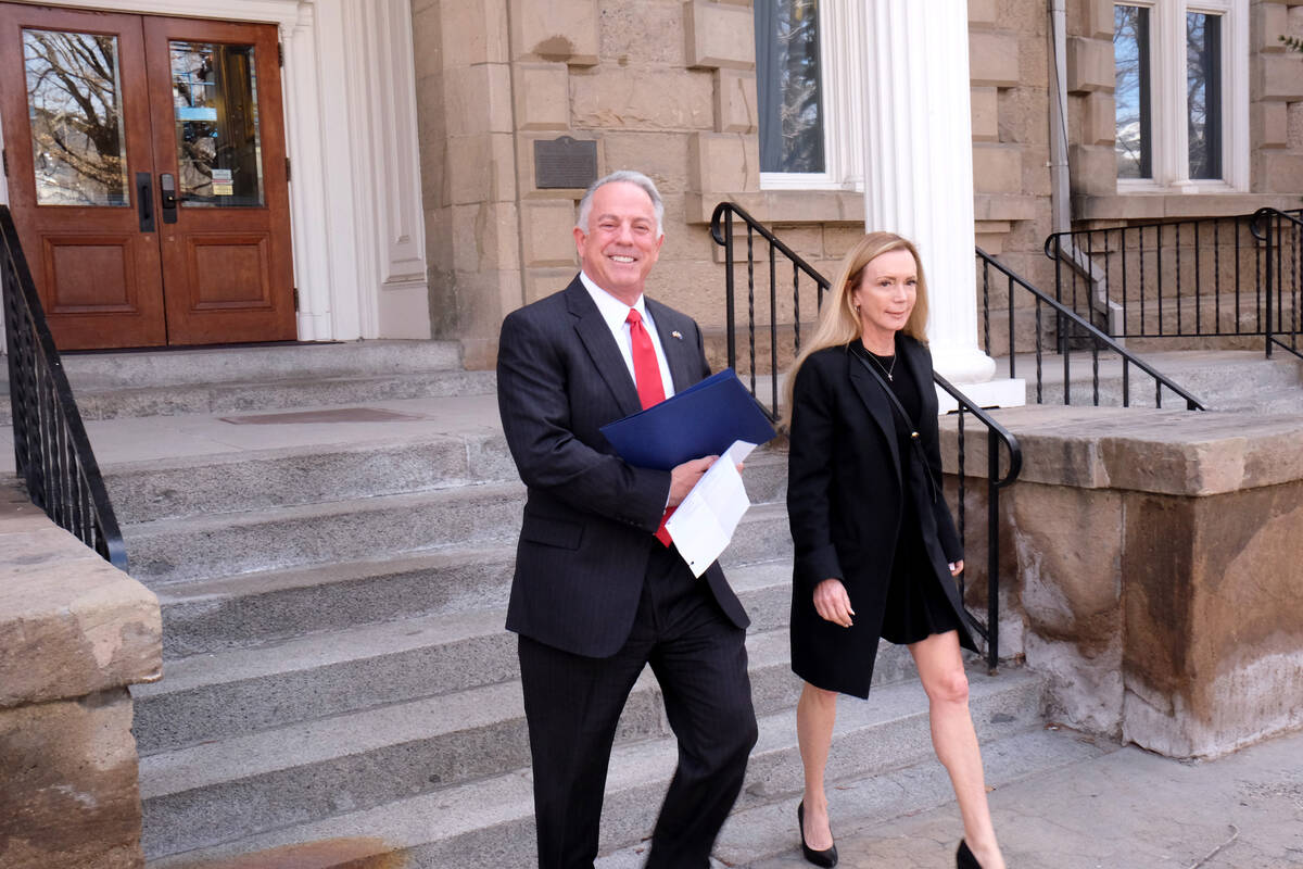 Clark County Sheriff Joe Lombardo leaves the Capitol Monday with his wife, Donna, after filing ...