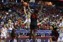 Boise State Broncos guard Marcus Shaver Jr. (10) attempts a shot under pressure from San Diego ...