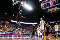 UNLV Rebels forward Donovan Williams (3) dunks the ball against the Wyoming Cowboys during the ...