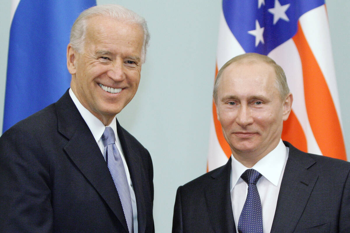 Joe Biden, left, shakes hands with Russian Prime Minister Vladimir Putin in Moscow in March 201 ...