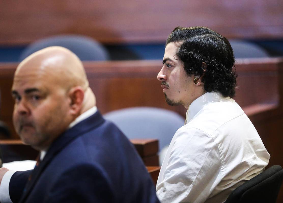 Defense attorney Erick Ferran, left, next to his client Edward Romero-Cordero, right, at his pr ...
