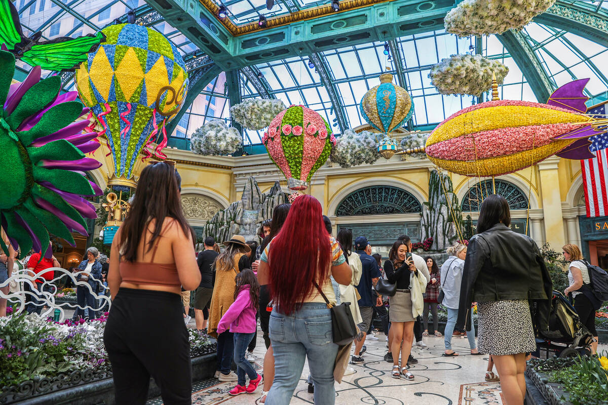 Visitors enjoy the new spring display “Flights of Fancy” at the Bellagio Conserva ...