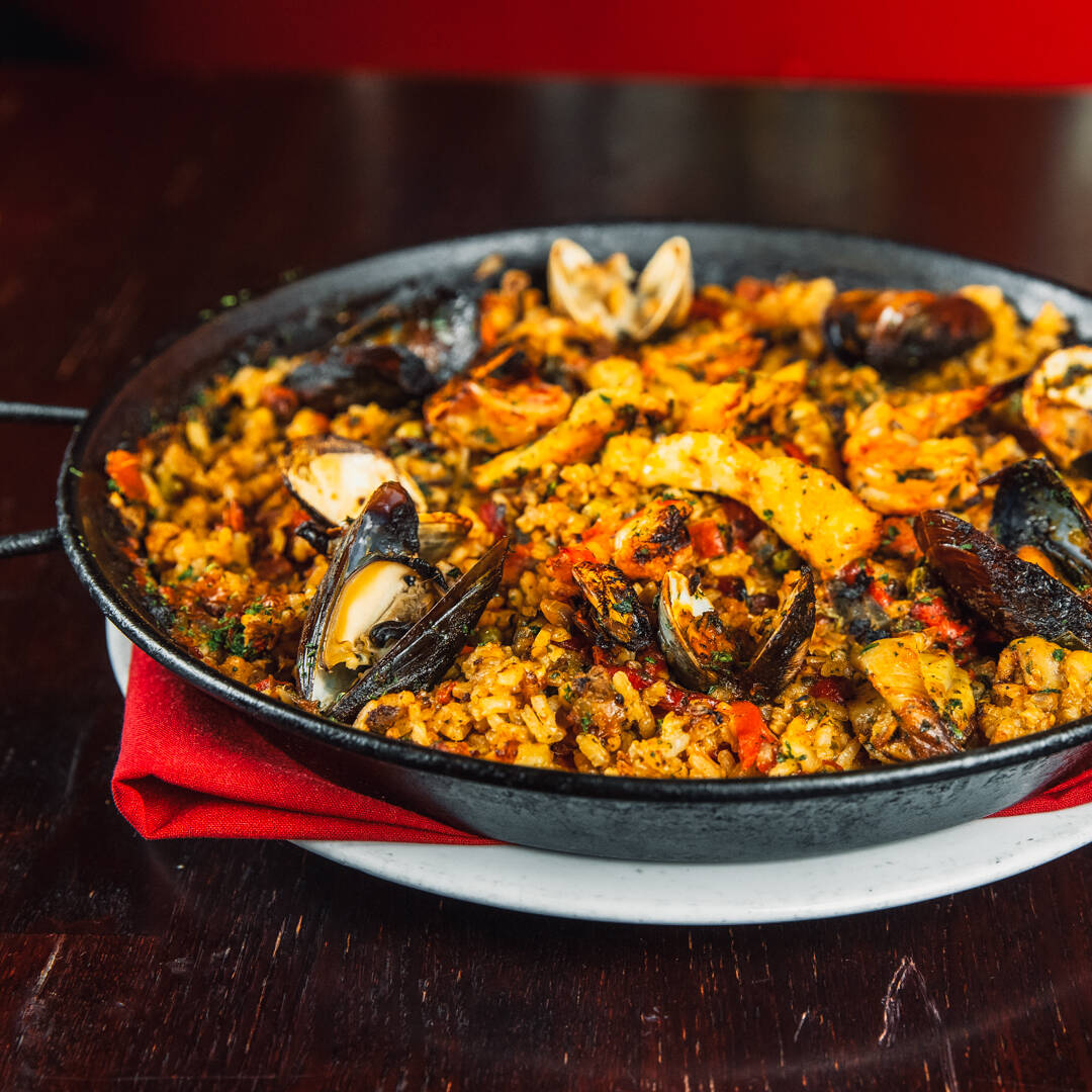 Paella is a tricky dish to prepare at home, requiring a special pan, sometimes hard-to-find ing ...