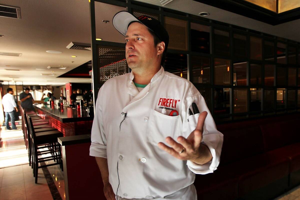 Chef and owner John Simmons speaks to the media as Firefly Tapas Kitchen and Bar opens their ne ...