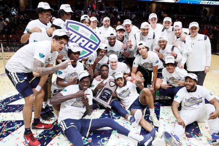 Akron players celebrate a win over Kent State in an NCAA college basketball game for the champi ...