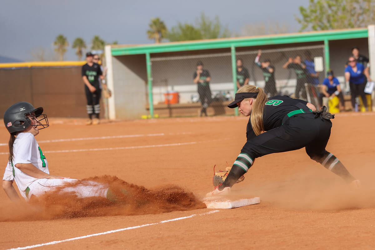 Green Valley’s Aspyn Beattie (9) attempts to tag Palo Verde’s Elayna Quigley (8) ...