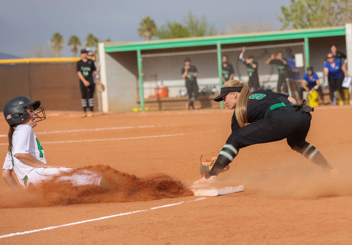 Green Valley’s Aspyn Beattie (9) attempts to tag Palo Verde’s Elayna Quigley (8) during a g ...