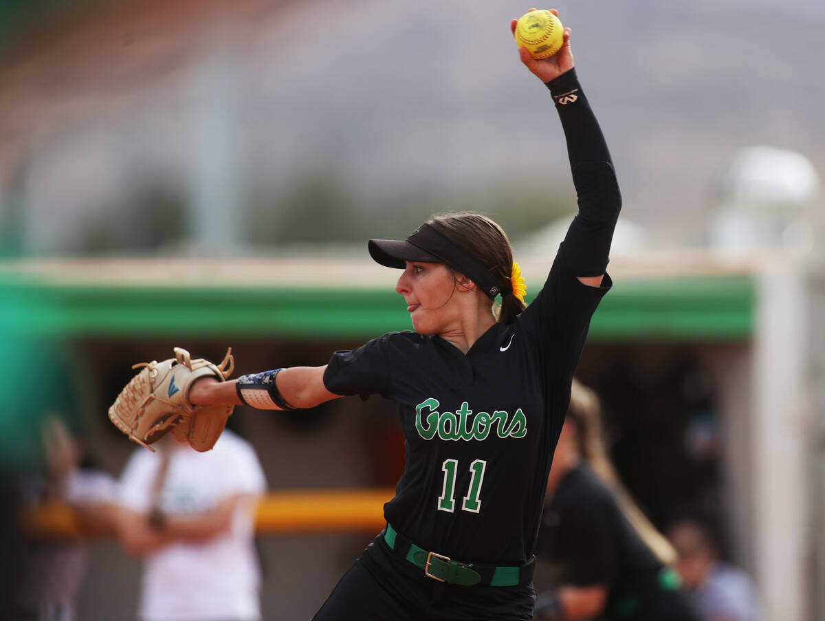 Green Valley’s Avari Morris (11) makes a pitch during a girls high school softball game ...