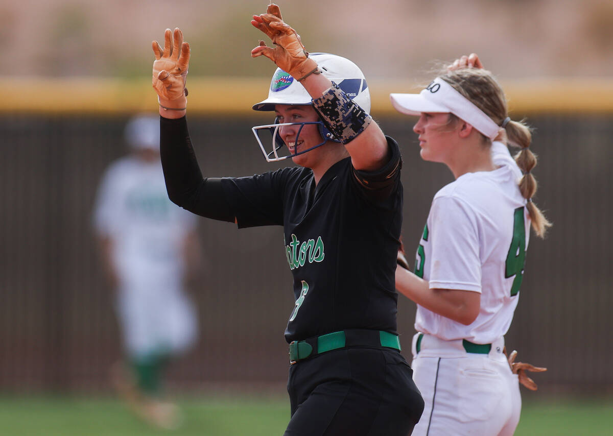 Green Valley’s Angelina Ortega (6) signals to her teammates after doubling during a girl ...