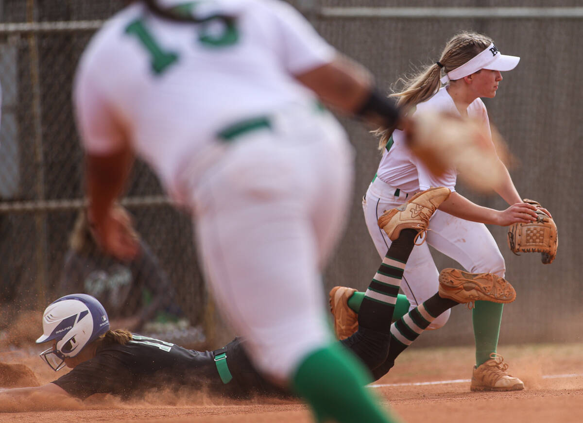 Green Valley’s Avari Morris (11) slides in safe to third past Palo Verde’s Paige ...