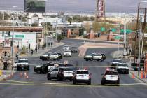 Las Vegas police investigate an officer-involved shooting on North Main Street between Foremast ...
