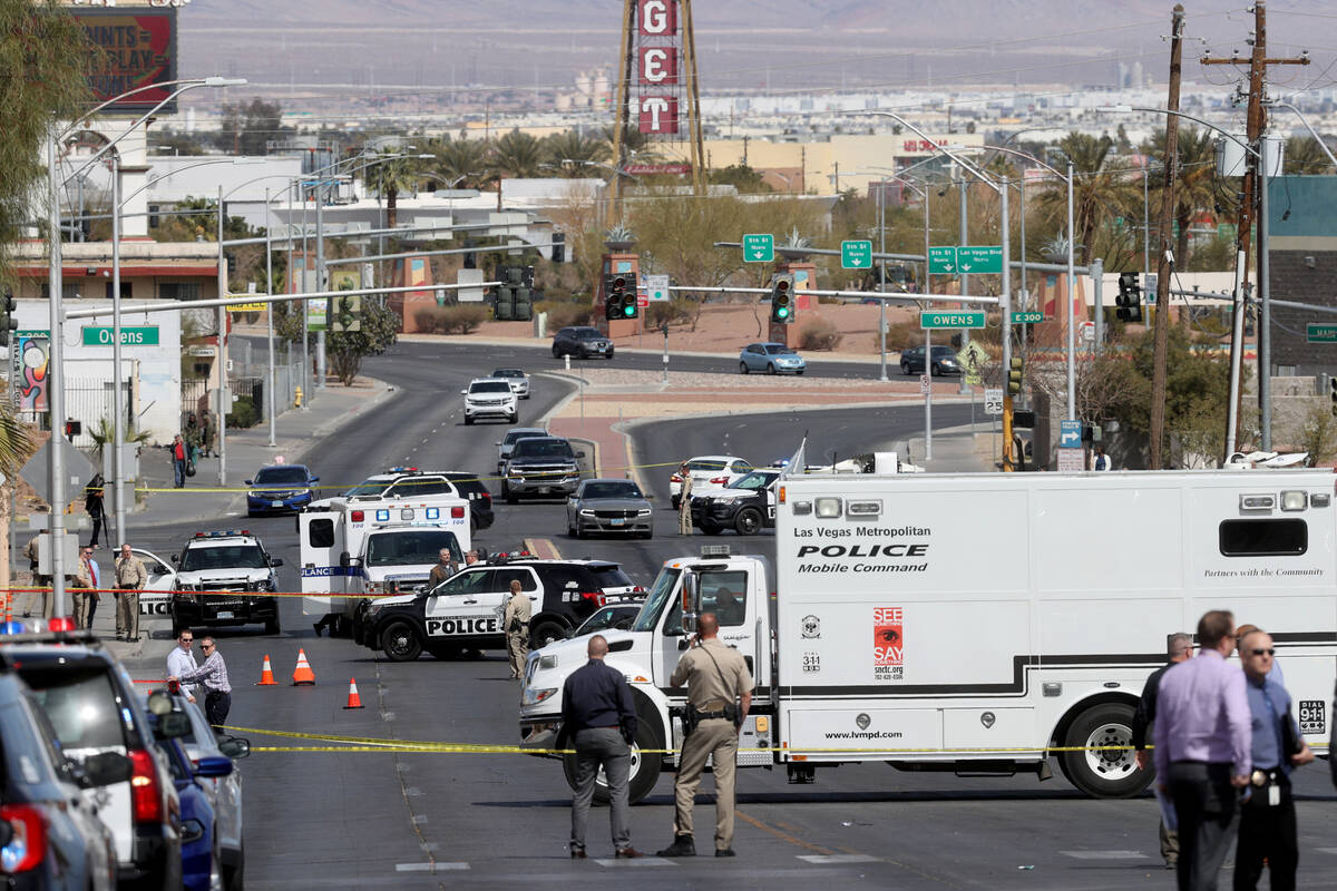 Las Vegas police investigate an officer-involved shooting on North Main Street between Foremast ...
