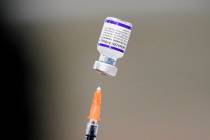 A syringe is prepared with the Pfizer COVID-19 vaccine at a vaccination clinic at the Keystone ...