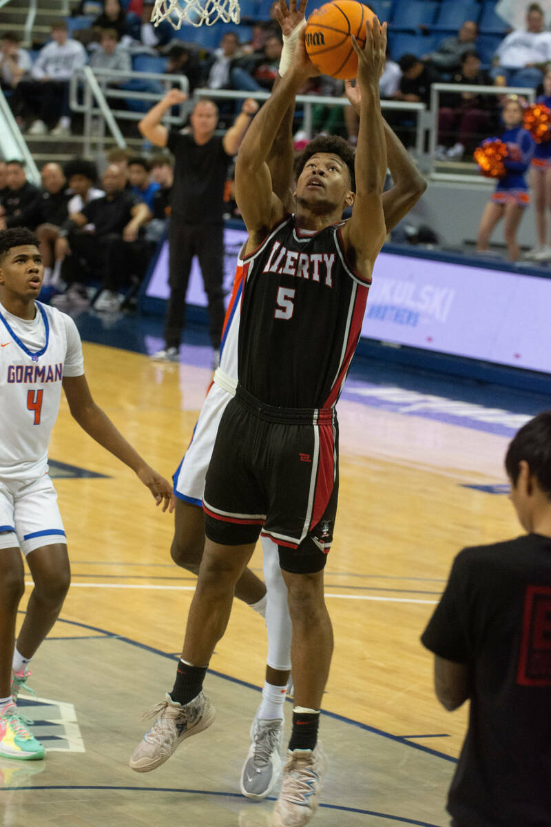 Joshua Jefferson of Liberty High School goes up for a shot during the NIAA Class 5A boys basket ...