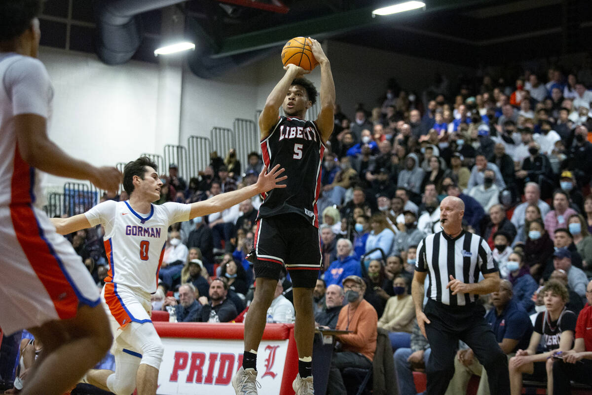 Liberty’s Joshua Jefferson (5) shoots against Bishop Gorman’s Ryan Abelman (0) du ...