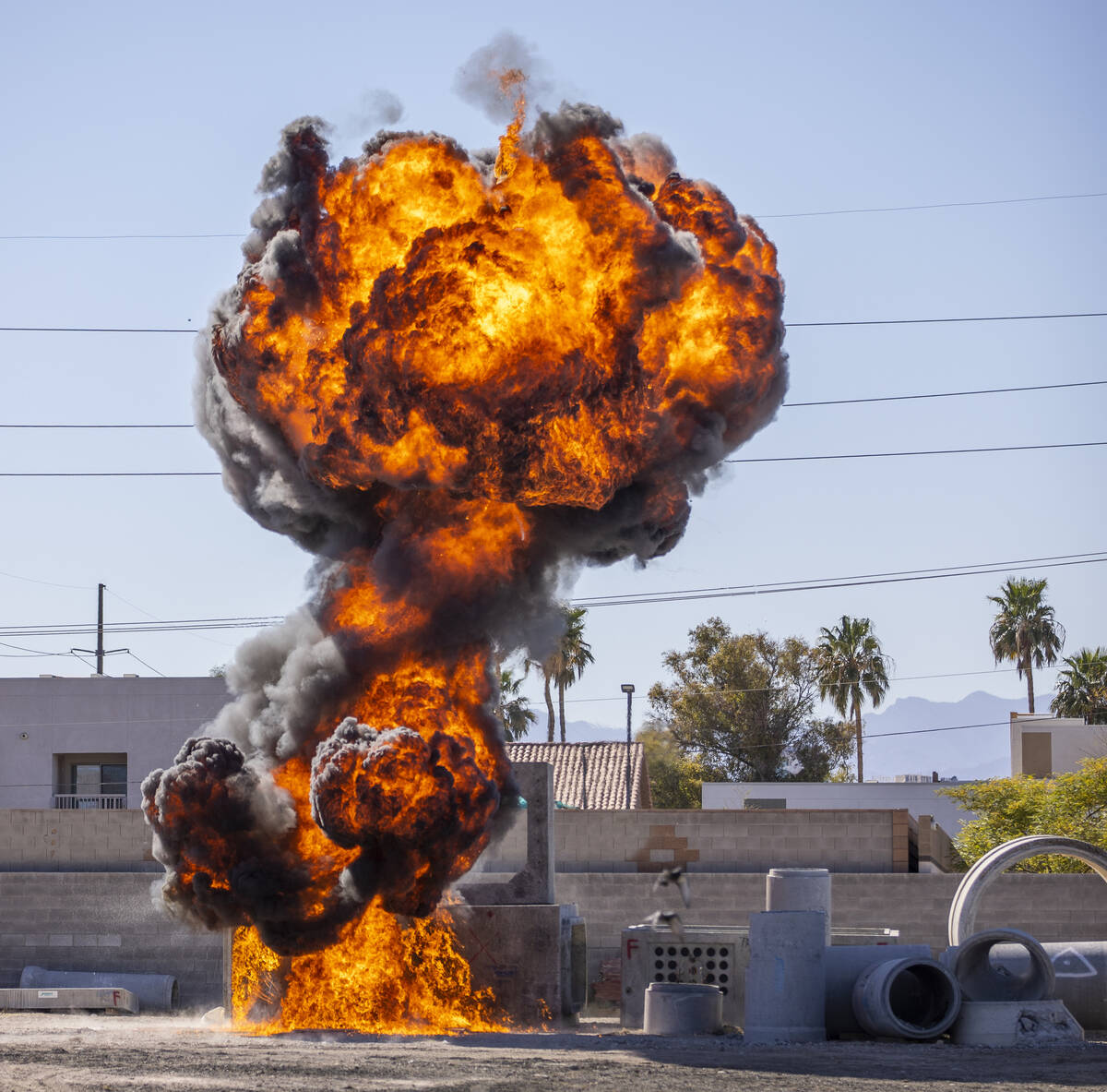 A fireball erupts during a controlled explosion on a media tour for the Las Vegas Fire & Rescue ...