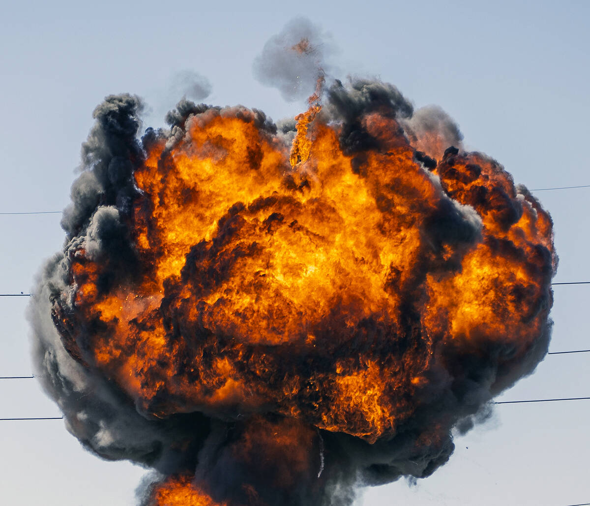 A fireball erupts during a controlled explosion on a media tour for the Las Vegas Fire & Rescue ...