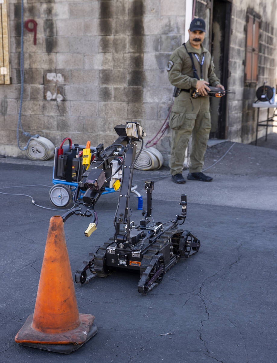 Technician Hoyt Jarrard operates an ICOR Mini Caliber Robot during a media tour for the Las Veg ...