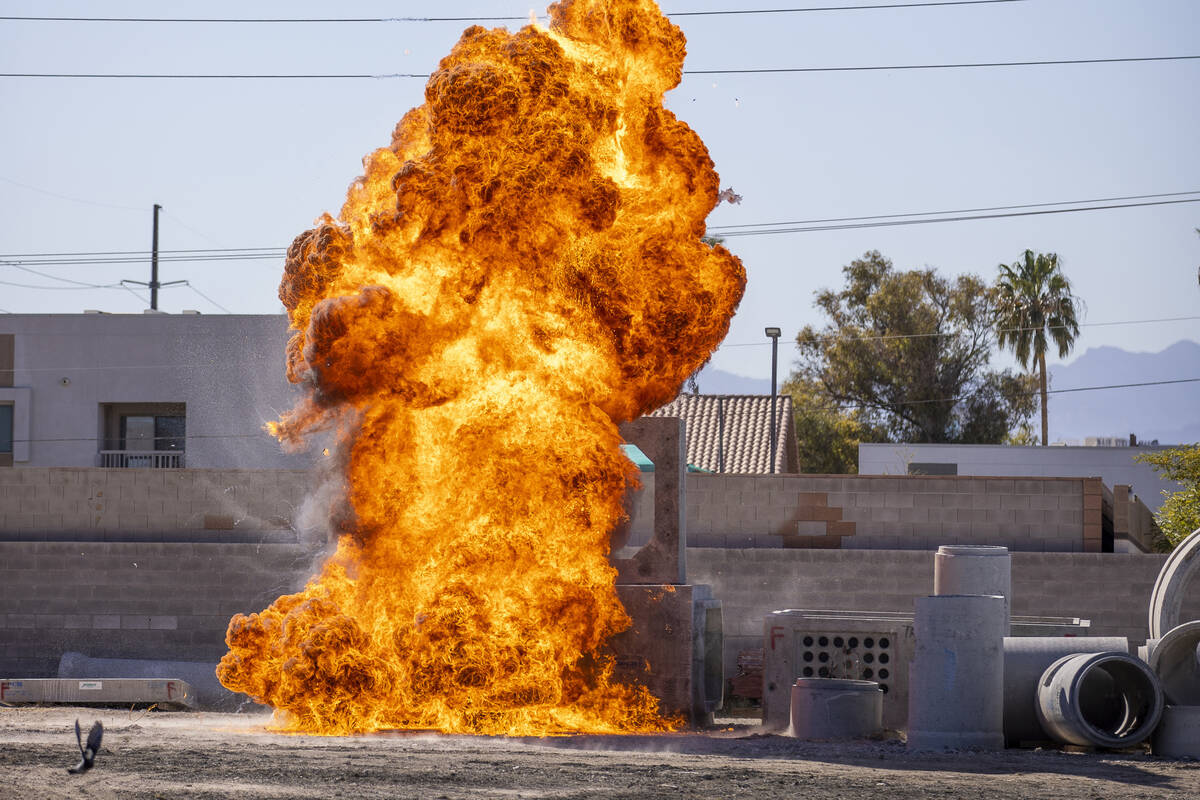A fireball erupts during a controlled explosion on a media tour for the Las Vegas Fire & Rescue ...