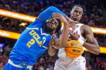 UCLA Bruins forward Cody Riley (2) has the ball ripped from his hands by Arizona Wildcats cente ...