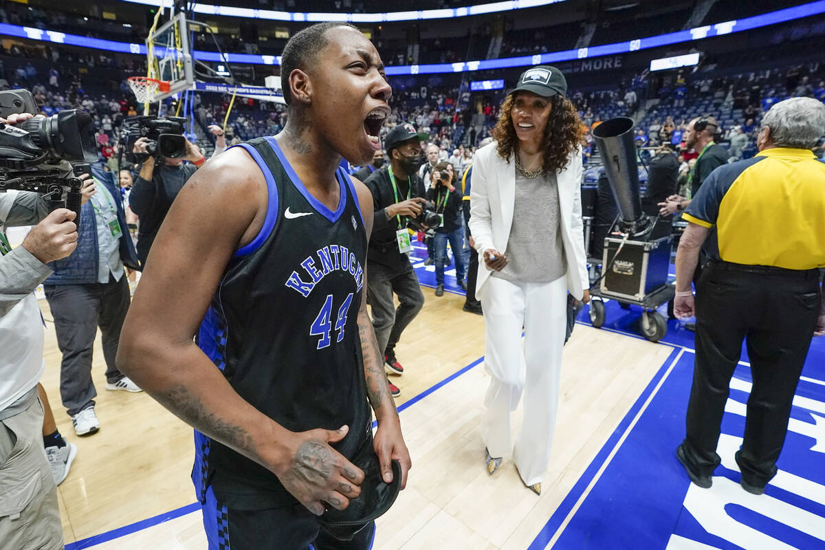 Kentucky's Dre'una Edwards (44) and head coach Kyra Elzy celebrate after beating South Carolina ...