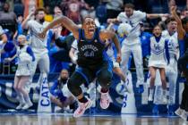 Kentucky's Dre'una Edwards (44) celebrates after making the winning shot to beat South Carolina ...