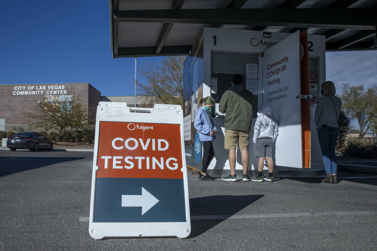 People wait and are served for COVID-19 testing at the Veterans Memorial Community Center on Tu ...