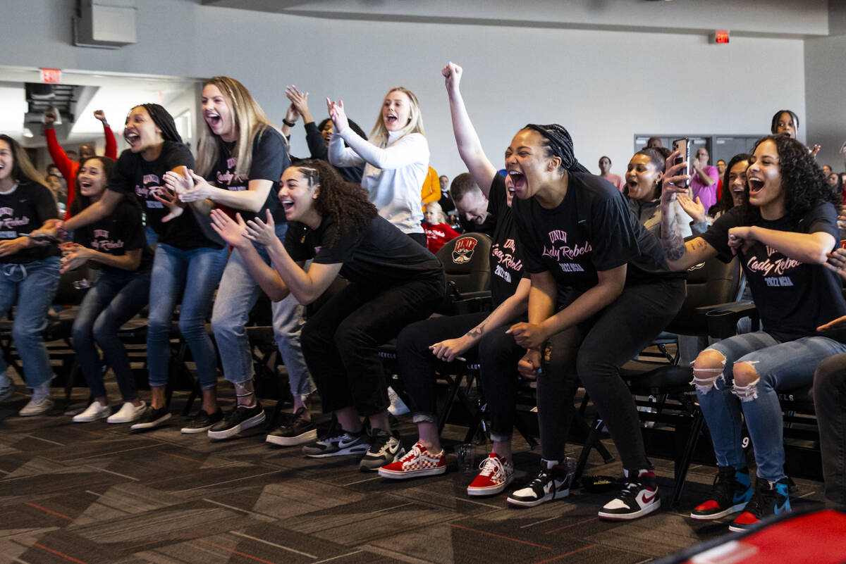 The UNLV Lady Rebels react while watching the NCAA selection show at the Thomas & Mack Center, ...