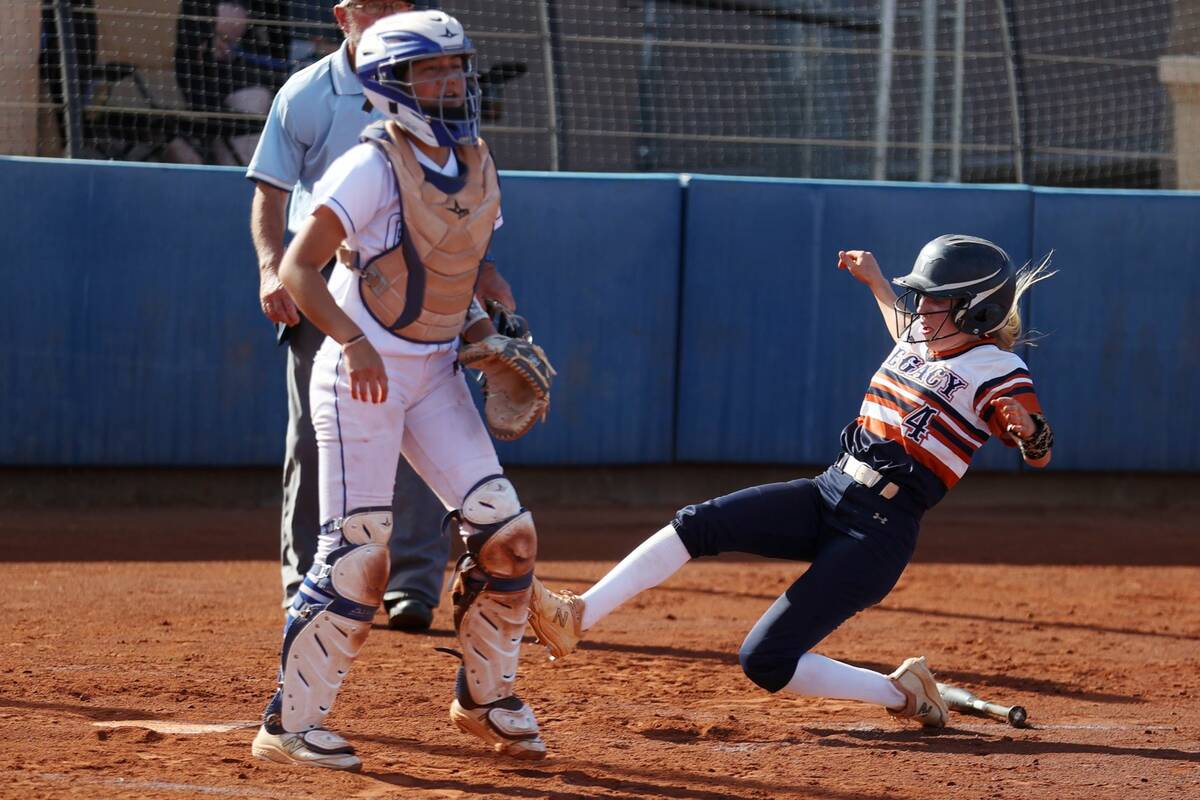 Legacy’s Brytnee Caldwell (4) slides home for run against Bishop Gorman during a softball gam ...