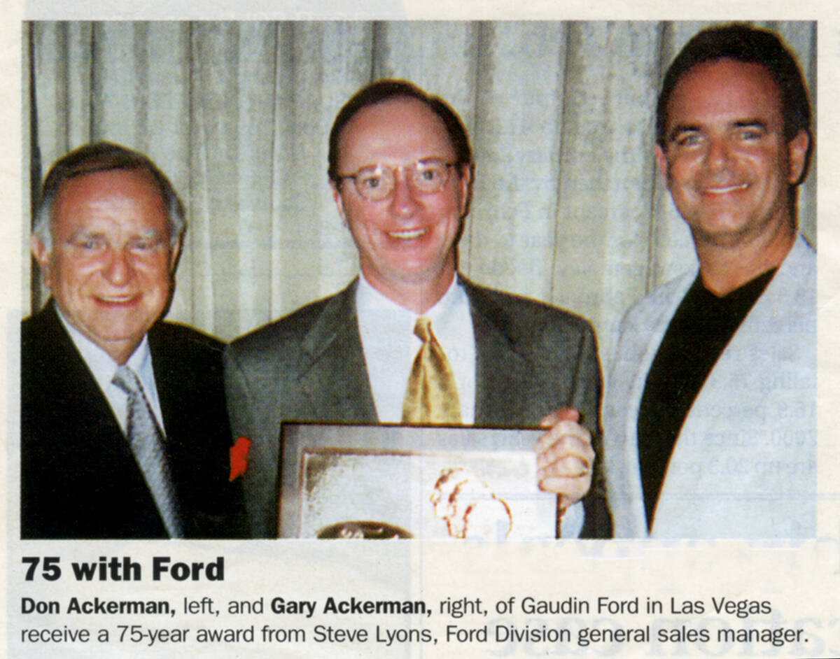 Don Ackerman, left, Ford Division general sales manager Steve Lyons and Gary Ackerman pose for ...