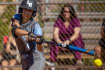 Centennial batter Ellie Bostedt (1) connects with a Faith Lutheran pitch during their NIAA girl ...