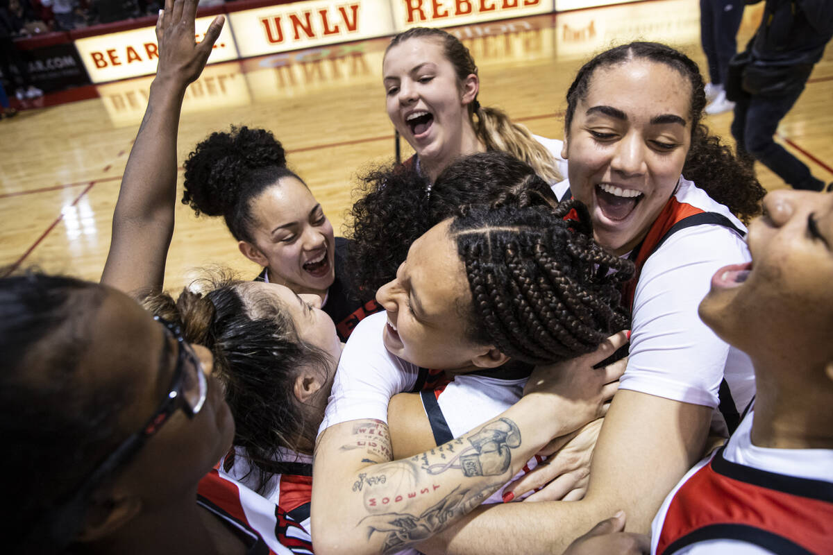 In this Thursday, Jan. 27, 2022, file photo, UNLV Lady Rebels guard Essence Booker gets a hug f ...