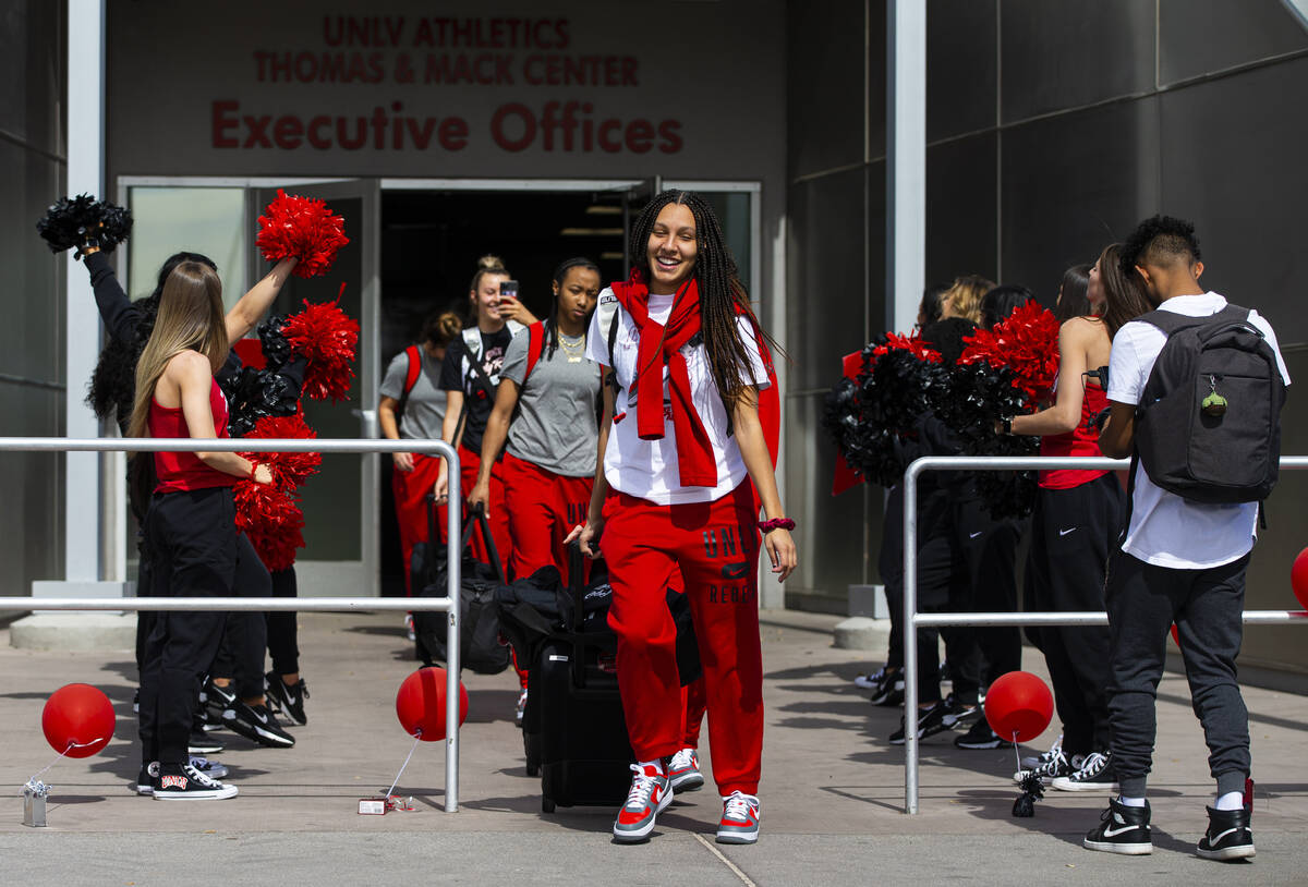 UNLV Lady Rebels guard Jade Thomas walks to the bus to head to Tuscon, Ariz. for the first roun ...